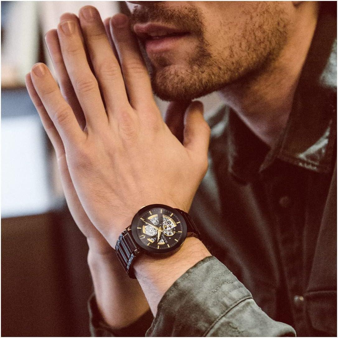 imageBulova Mens Modern 3Hand Automatic Watch Open Aperture Dial and Edge to Edge CrystalBlack IonPlatedGold Tone Accents