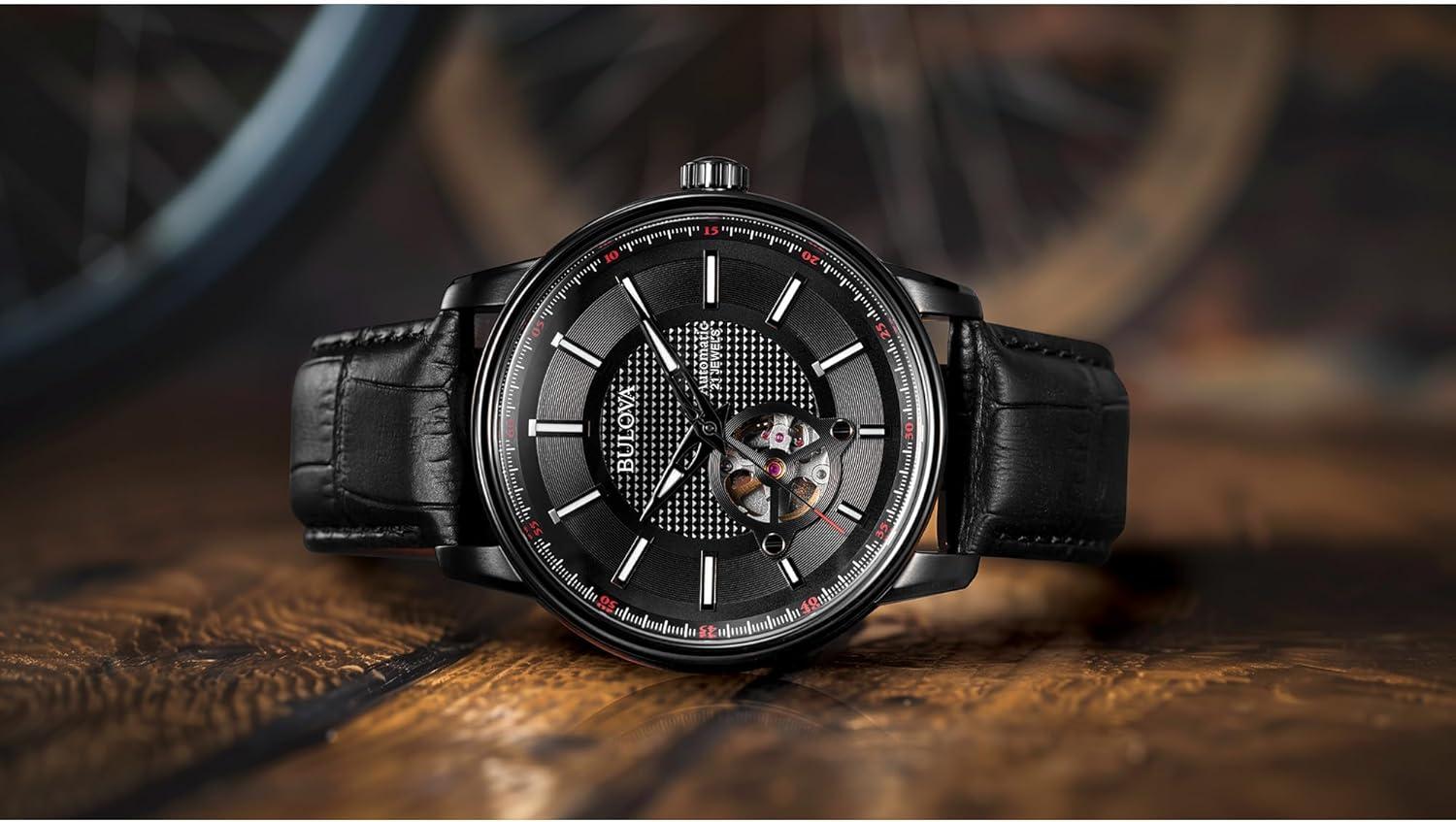 imageBulova Mens Classic 3Hand Automatic Leather Strap Watch 21Jewels Hack Feature Luminous Hands and MarkersOpen Aperture and Exhibition Case BackBlack StrapBlack IonPlated
